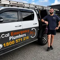 Plumber beside a service vehicle, Hampton
