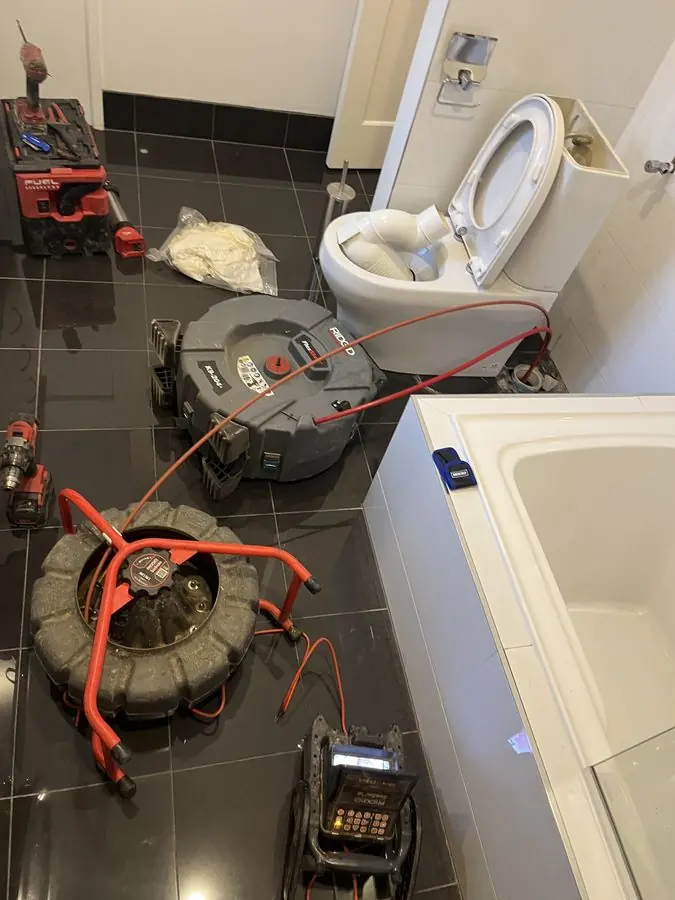 Drain clearing equipment in a bathroom, Hampton
