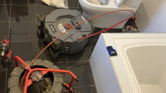 Drain clearing equipment in a bathroom, Hampton